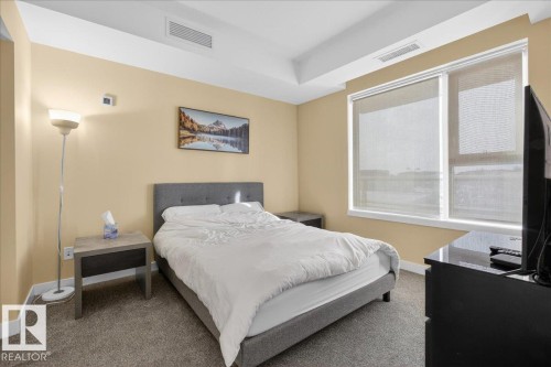 Carpeted bedroom featuring baseboards - 301 2504 109 Street, Edmonton, AB - Indoor Photo Showing Bedroom