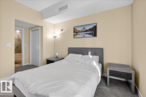 Carpeted bedroom with baseboards and a closet - 301 2504 109 Street, Edmonton, AB - Indoor Photo Showing Bedroom