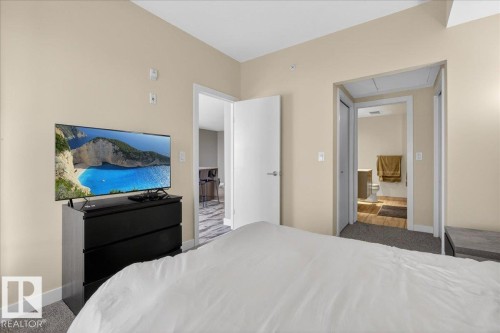 Carpeted bedroom featuring baseboards - 301 2504 109 Street, Edmonton, AB - Indoor Photo Showing Bedroom
