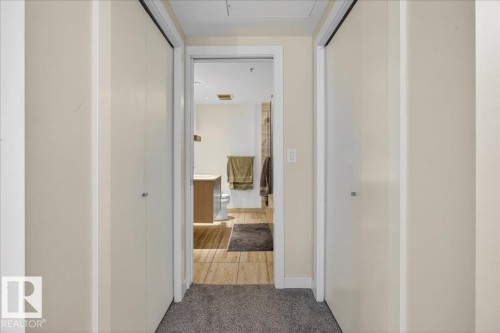 Hall with carpet flooring and baseboards - 301 2504 109 Street, Edmonton, AB - Indoor Photo Showing Other Room
