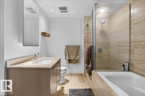 Bathroom featuring a shower stall, vanity, and a bath - 301 2504 109 Street, Edmonton, AB - Indoor Photo Showing Bathroom