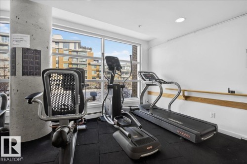 Exercise room with dark rubber floors - 301 2504 109 Street, Edmonton, AB - Indoor Photo Showing Gym Room