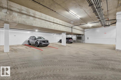 Garage featuring a parking deck - 301 2504 109 Street, Edmonton, AB - Indoor Photo Showing Garage
