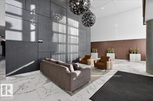 Common area with a high ceiling, wood walls, and recessed lighting - 301 2504 109 Street, Edmonton, AB - Indoor Photo Showing Other Room