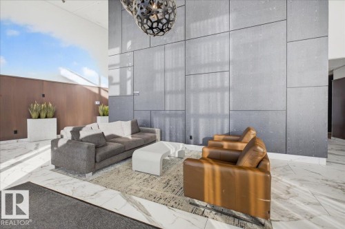 Community lobby featuring a high ceiling and wooden walls - 301 2504 109 Street, Edmonton, AB - Indoor Photo Showing Other Room