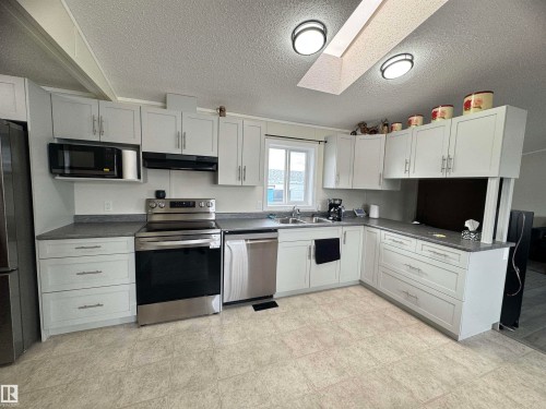 83 9501 104 Ave, Westlock, AB - Indoor Photo Showing Kitchen With Double Sink