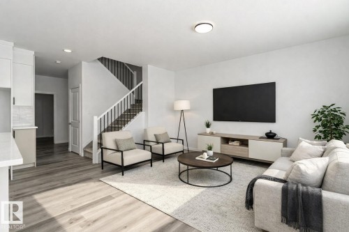 Living room with light wood-style floors and recessed lighting - 3790 Wren Loop, Edmonton, AB - Indoor Photo Showing Living Room