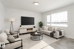 Living area featuring light wood-style flooring and baseboards - 