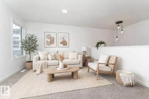 Living room featuring baseboards and carpet floors - 3790 Wren Loop, Edmonton, AB - Indoor Photo Showing Living Room