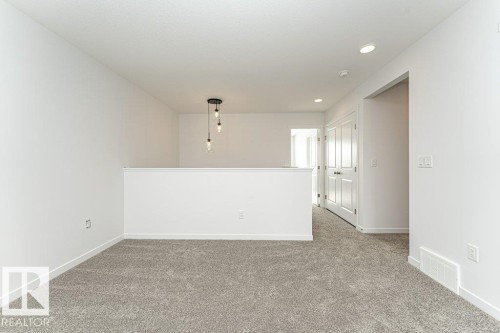 Spare room featuring light colored carpet and recessed lighting - 3790 Wren Loop, Edmonton, AB - Indoor Photo Showing Other Room