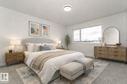 Carpeted bedroom with baseboards - 
