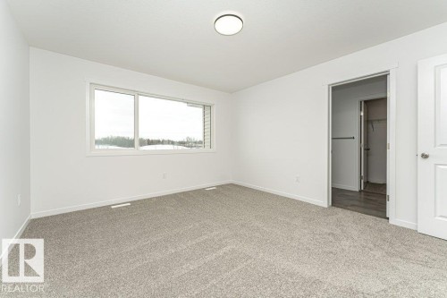 Unfurnished bedroom featuring carpet and baseboards - 3790 Wren Loop, Edmonton, AB - Indoor Photo Showing Other Room