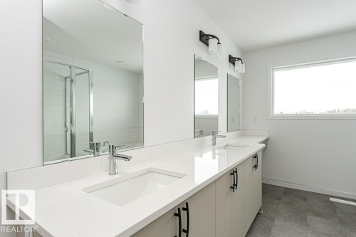Bathroom featuring double vanity and a stall shower - 3790 Wren Loop, Edmonton, AB - Indoor Photo Showing Bathroom