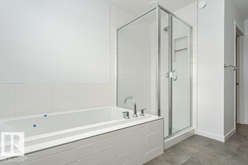 Full bath featuring a garden tub and a shower stall - 3790 Wren Loop, Edmonton, AB - Indoor Photo Showing Bathroom