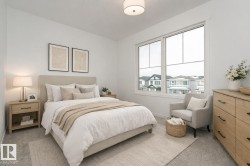 Bedroom with light carpet and baseboards - 