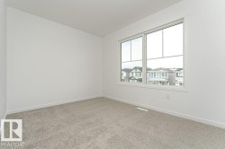 Carpeted empty room with baseboards - 