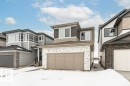 View of front facade featuring a garage and brick siding - 3790 Wren Loop, Edmonton, AB  - Outdoor With Facade 