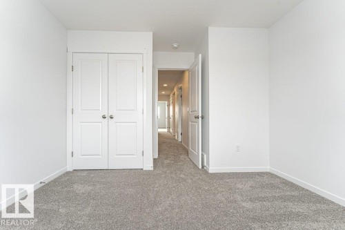 Unfurnished bedroom with carpet flooring and a closet - 3790 Wren Loop, Edmonton, AB - Indoor Photo Showing Other Room