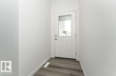 Doorway to outside featuring baseboards and wood finished floors - 3790 Wren Loop, Edmonton, AB  - Indoor Photo Showing Other Room 