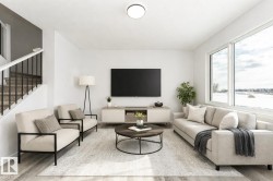 Living area featuring light wood-type flooring and stairs - 