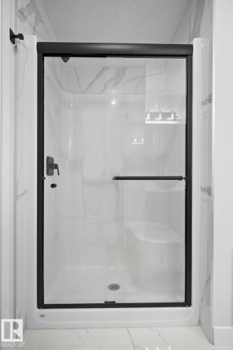 Full bathroom featuring a shower stall and a textured ceiling - 3912 41 Avenue, Beaumont, AB - Indoor Photo Showing Bathroom