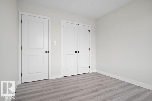 Unfurnished bedroom with light wood-type flooring and a closet - 3912 41 Avenue, Beaumont, AB - Indoor Photo Showing Other Room