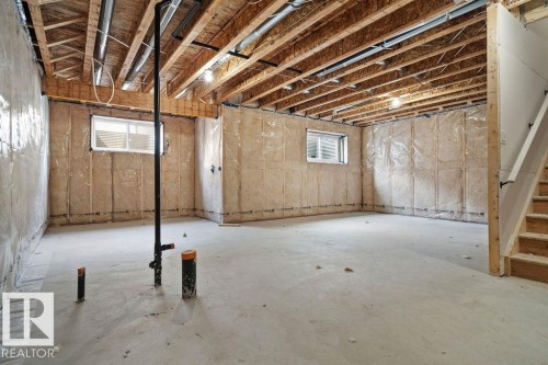 Basement featuring plenty of natural light - 3912 41 Avenue, Beaumont, AB - Indoor Photo Showing Basement