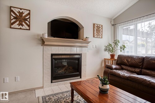 1825 Tufford Way, Edmonton, AB - Indoor Photo Showing Living Room With Fireplace