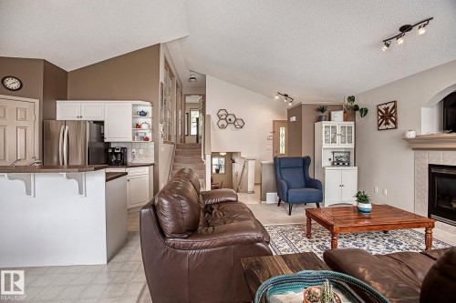1825 Tufford Way, Edmonton, AB - Indoor Photo Showing Other Room With Fireplace
