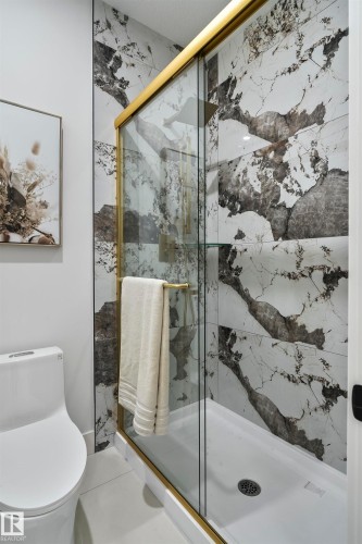 Full bath with a marble finish shower - 13152 187 Avenue, Edmonton, AB - Indoor Photo Showing Bathroom