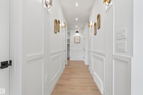 Corridor with recessed lighting, light wood-type flooring, a decorative wall, and a wainscoted wall - 13152 187 Avenue, Edmonton, AB - Indoor Photo Showing Other Room