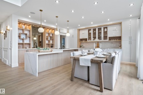 Kitchen with open shelves, light wood-type flooring, glass insert cabinets, light stone countertops, and tasteful backsplash - 13152 187 Avenue, Edmonton, AB - Indoor Photo Showing Kitchen With Upgraded Kitchen