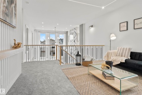 Living area featuring carpet, an upstairs landing, and recessed lighting - 13152 187 Avenue, Edmonton, AB - Indoor Photo Showing Other Room