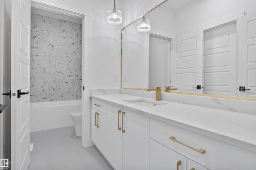 Bathroom featuring vanity, light tile patterned floors, and bathtub / shower combination - 13152 187 Avenue, Edmonton, AB - Indoor Photo Showing Bathroom