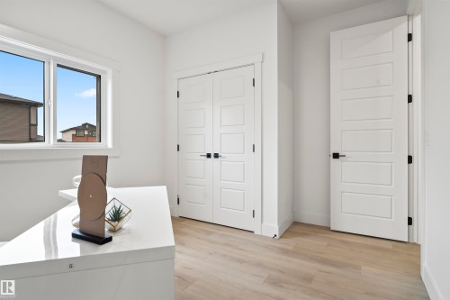 Unfurnished office with light wood finished floors and baseboards - 13152 187 Avenue, Edmonton, AB - Indoor