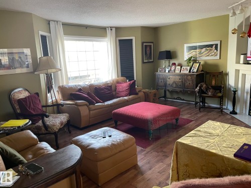 2 1295 Carter Crest Road, Edmonton, AB - Indoor Photo Showing Living Room With Fireplace