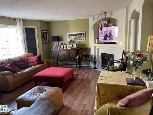 2 1295 Carter Crest Road, Edmonton, AB - Indoor Photo Showing Living Room With Fireplace