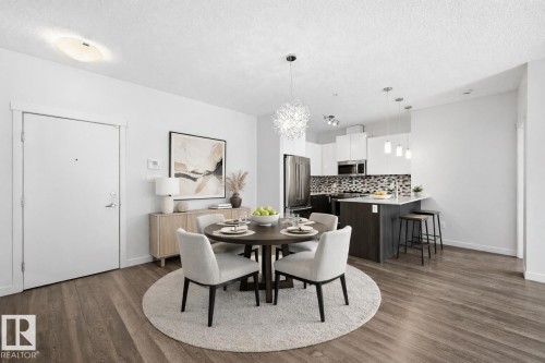 Virtually staged kitchen and dining area - 106 812 Welsh Drive, Edmonton, AB - Indoor Photo Showing Dining Room
