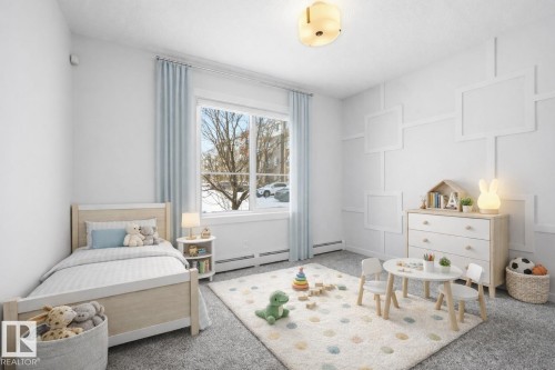 Virtually staged second bedroom - 106 812 Welsh Drive, Edmonton, AB - Indoor Photo Showing Bedroom
