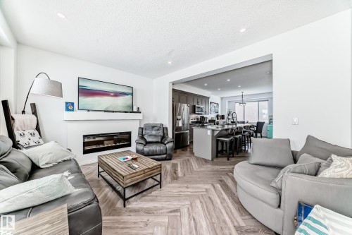 36 2072 Wonnacott Way, Edmonton, AB - Indoor Photo Showing Living Room With Fireplace