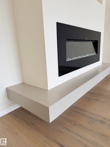 22 9703 174 Street Nw, Edmonton, AB - Indoor With Fireplace