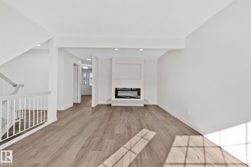 22 9703 174 Street Nw, Edmonton, AB - Indoor With Fireplace