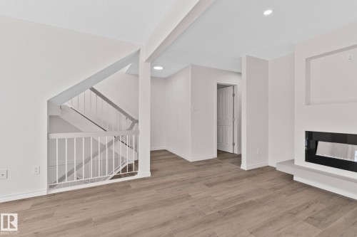 22 9703 174 Street Nw, Edmonton, AB - Indoor With Fireplace