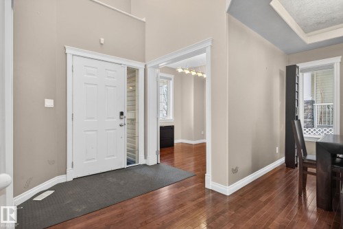 Entryway featuring dark wood-style flooring and baseboards - 613 Stewart Crescent, Edmonton, AB - Indoor Photo Showing Other Room