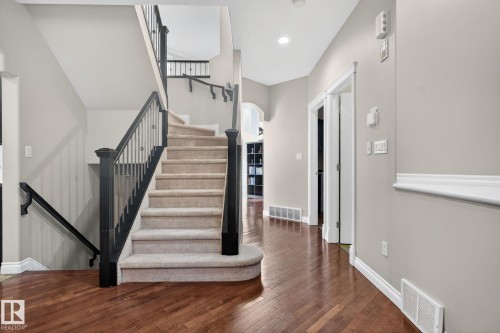 Stairs with hardwood / wood-style floors and recessed lighting - 613 Stewart Crescent, Edmonton, AB - Indoor Photo Showing Other Room