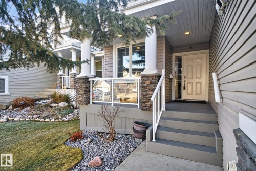 Entrance to property with stone siding and a yard - 613 Stewart Crescent, Edmonton, AB - Outdoor
