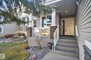 Entrance to property with stone siding and a yard - 613 Stewart Crescent, Edmonton, AB  - Outdoor 