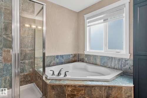 Bathroom featuring a shower stall and a bath - 613 Stewart Crescent, Edmonton, AB - Indoor Photo Showing Bathroom