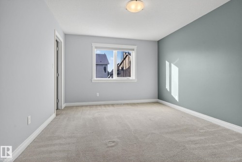 Spare room with light carpet and baseboards - 613 Stewart Crescent, Edmonton, AB - Indoor Photo Showing Other Room