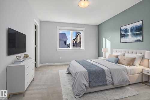 Bedroom featuring light colored carpet and baseboards - 613 Stewart Crescent, Edmonton, AB - Indoor Photo Showing Bedroom